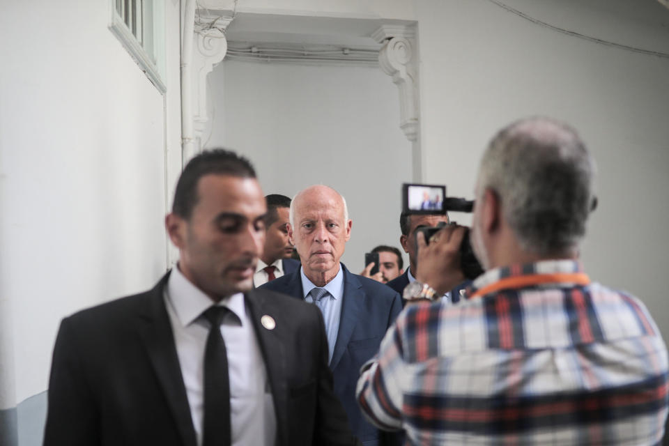 Tunisian former conservative constitutional law professor Kais Saied arrives at his office in Tunis, Tunisia, Tuesday, Sept. 17, 2019. With more than half the votes in Tunisia's presidential race counted, Kais Saied was in the lead. Media magnate Nabil Karoui, a more modernizing candidate, was in second place with 15.5%. (AP Photo/Mosa'ab Elshamy)