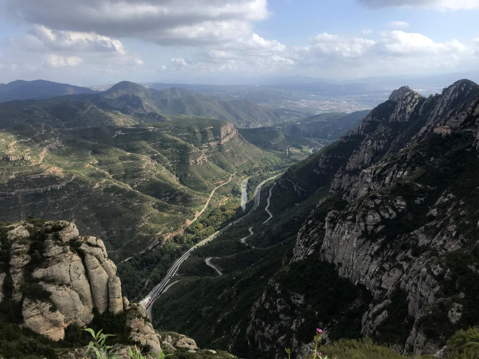 This Oct.13, 2019 photo shows the green valley viewed from the top of the Montserrat mountains outside Barcelona. (Courtney Bonnell via AP)