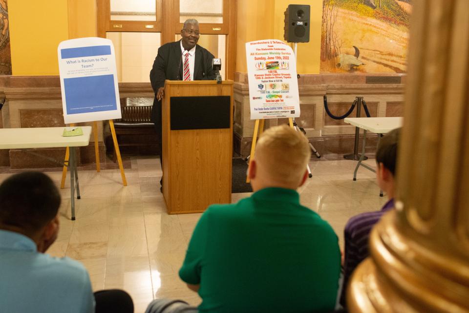 Curtis Pitts speaks Tuesday at a Juneteenth event at the Statehouse. The self-described community servant is asking lawmakers to turn a historical Black school that was converted to a prison back to the community.