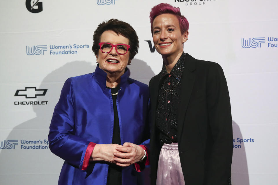 FILE - In this Wednesday, Oct. 16, 2019, file photo, tennis great and founder of the Women's Sports Foundation Billie Jean King, left, and soccer star Megan Rapinoe pose for photos on the red carpet of the Women's Sports Foundation's 40th annual Salute to Women in Sports in New York. Players for the U.S. women’s national team may have been dealt a blow by a judge’s ruling in their gender discrimination case against U.S. Soccer, but the case is far from over. The women have vowed to keep up the fight, encouraged by the likes of Joe Biden, Billie Jean King and even the men's national team. And then there’s the possibility of an appeal. (AP Photo/Mary Altaffer, File)