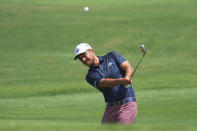 Xander Schauffele chips the ball to the third green during the second round of the Tour Championship golf tournament at East Lake Golf Club, Friday, Aug. 26, 2022, in Atlanta. (AP Photo/Steve Helber)