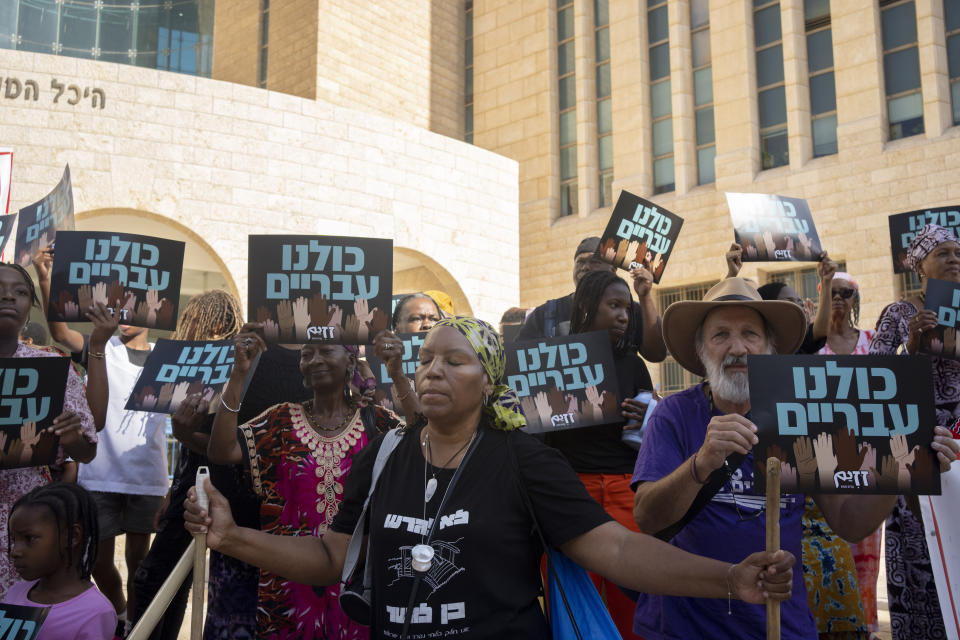 Estella Rivers, a member of the African Hebrew Israelites of Jerusalem, pauses during a rally outside of the District Court in Beersheba, Israel, ahead of a hearing on the deportation orders for her and dozens of others from her community, Wednesday, July 19, 2023. Over the decades, the community has made inroads into Israeli society, and most of them have citizenship or residency rights. But 130 members remain undocumented, and Israeli authorities have ordered them to leave. The orders have left dozens of people, some of whom have lived most of their lives in Israel, in an uncertain legal limbo. (AP Photo/Maya Alleruzzo)