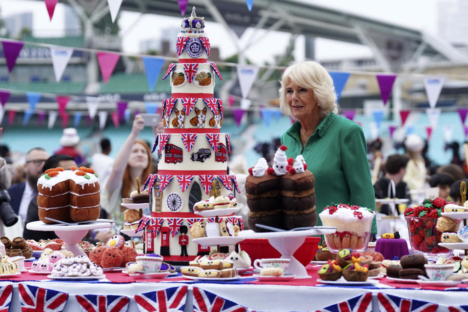 Camilla, Duchess of Cornwall, as Patron of the Big Lunch, arrives for the Big Jubilee Lunch with tables set up on the pitch at The Oval cricket ground, on the last of four days of celebrations to mark Queen Elizabeth II's Platinum Jubilee, in London, Sunday, June 5, 2022. (Stefan Rousseau/PA via AP)