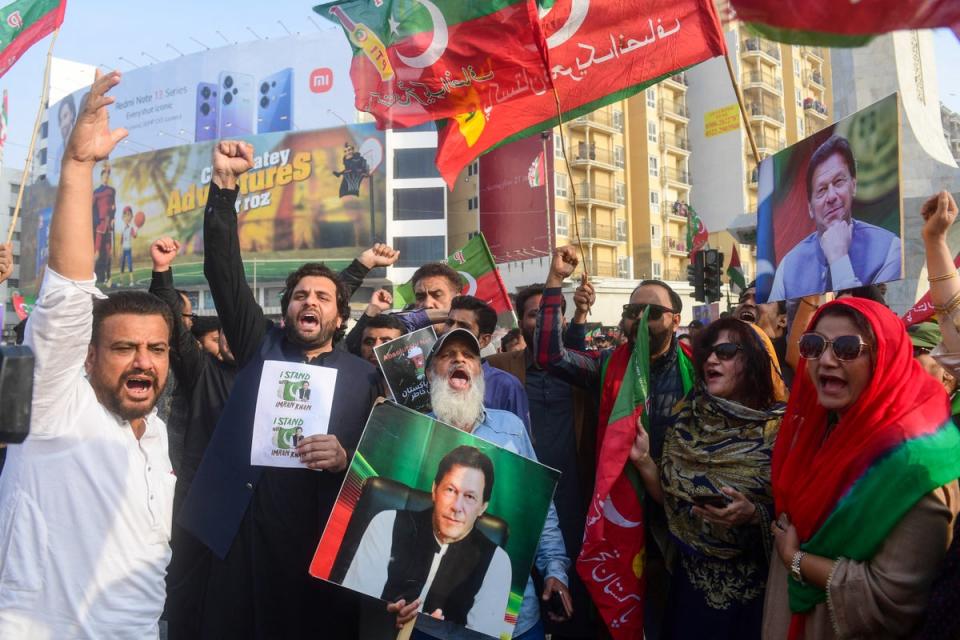Supporters of Pakistan Tehreek-e-Insaf (PTI) party shout slogans and protest to demand the release of Pakistan's jailed former prime minister Imran Khan (AFP via Getty Images)