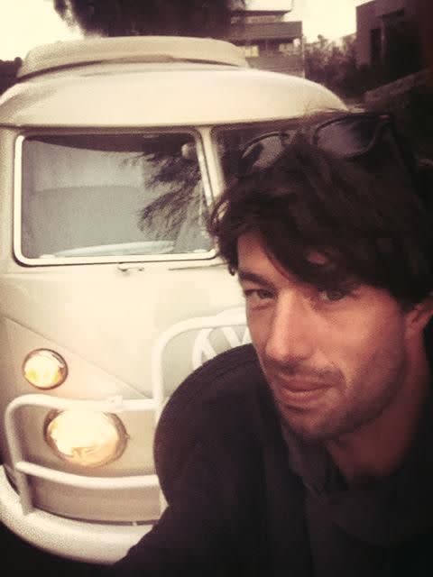 Sean McKinnon poses with his campervan, where he was shot dead.