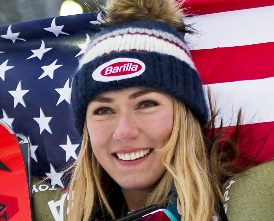 Mikaela Shiffrin of the United States, gold medal, celebrates during the flower ceremony after the women Super-G race at the 2019 FIS Alpine Skiing World Championships in Are, Sweden Tuesday, Feb. 5, 2019. (Jean-Christophe Bott/Keystone via AP)