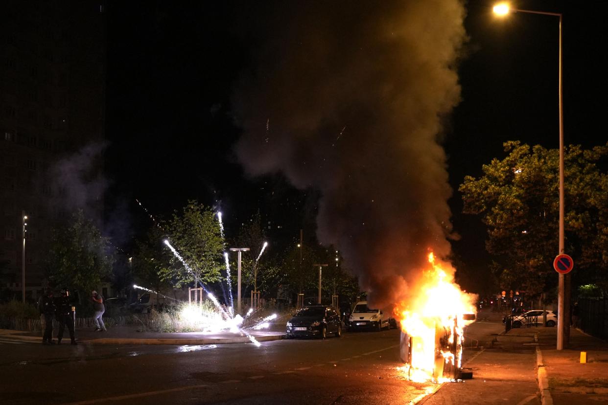 Fireworks explode during protests in Nanterre, west of Paris, on 28 June 2023 (AFP via Getty Images)