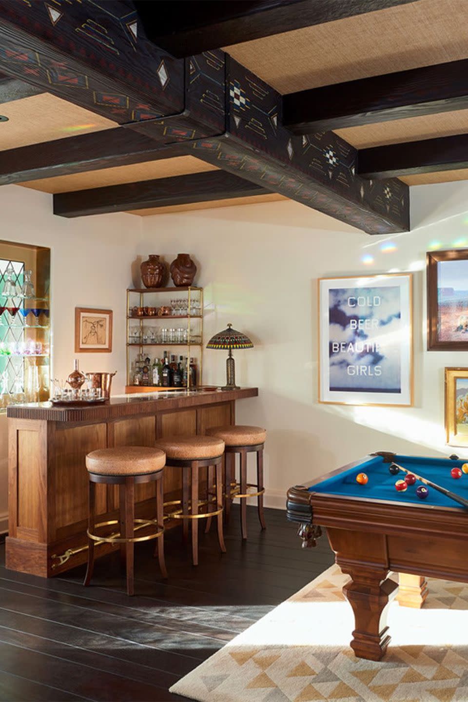 <p>Home bar and game room or exclusive speakeasy? Designed by <a href="https://www.communedesign.com/" rel="nofollow noopener" target="_blank" data-ylk="slk:Commune;elm:context_link;itc:0;sec:content-canvas" class="link ">Commune</a>, this billiard room is the ultimate post-dinner hang out for both kids and adults. </p>