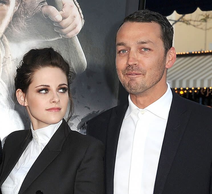 Kristen Stewart and Rupert Sanders attend the premiere of their movie.