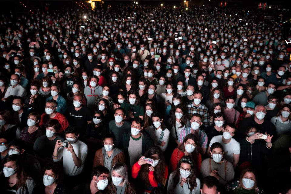 A crowd dons face masks to attend a concert by Love of Lesbian in Barcelona on March 27, 2021. Attendees were required to pass a same-day COVID-19 screening.
