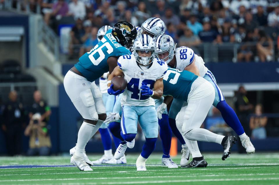 Dallas Cowboys running back Deuce Vaughn (42) runs for yardage during the second half against the Jacksonville Jaguars at AT&T Stadium.