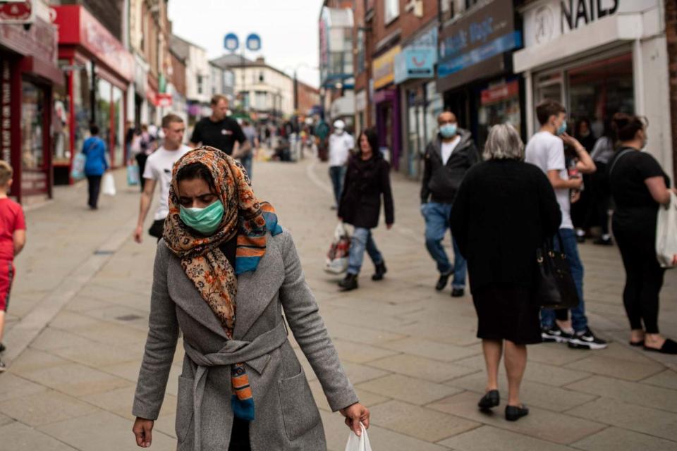 People out in Oldham town centre (AFP via Getty Images)