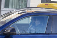 Novak Djokovic, back, and his brother Djordje are seen inside a vehicle in Belgrade, Serbia, Monday, Jan. 17, 2022. Djokovic arrived in his native Serbia on Monday after being deported from Australia because he was not vaccinated against COVID-19, ending his hopes of defending his Australian Open title. (AP Photo/Marko Drobnjakovic)