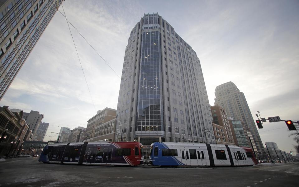 The light rail travels in downtown Salt Lake City Wednesday, Jan. 9, 2013. Built with the 2002 Winter Olympics in mind, Salt Lake City’s light-rail network is free for passengers as it weaves through downtown. Riders can get to and from major attractions such as Temple Square, City Creek Center, Salt Lake City Library, Energy Solutions Arena and the Gateway for free. An extension leading to the airport is expected to open this spring, but that trips on that section will cost riders. (AP Photo/Rick Bowmer)