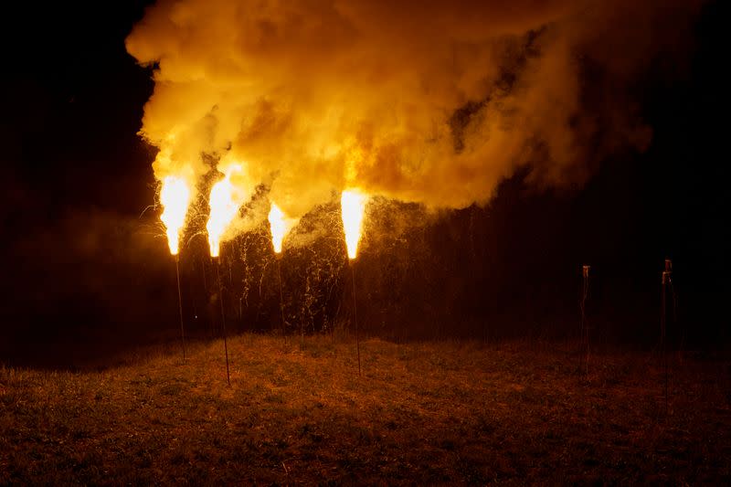 Flares of magnesium powder are pictured during the illumination to celebrate Swiss National Day in Evolene