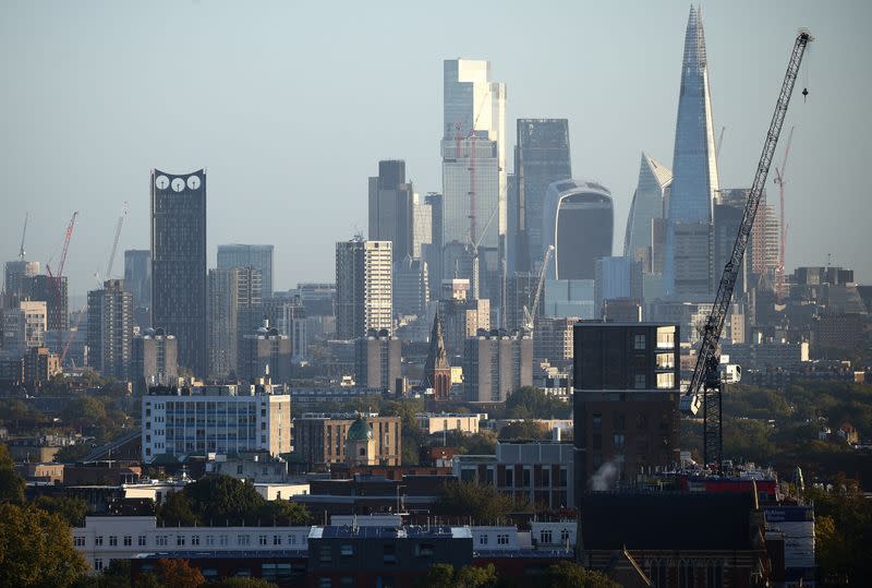 The City of London financial district can be seen in the distance beyond housing developments in London