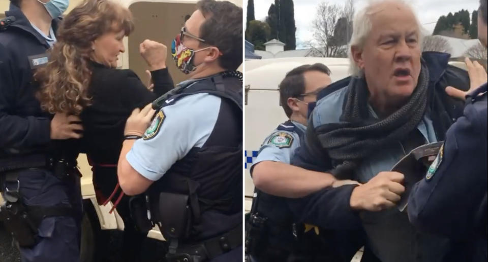 A man and woman are seen with police officers in Bowral, NSW.