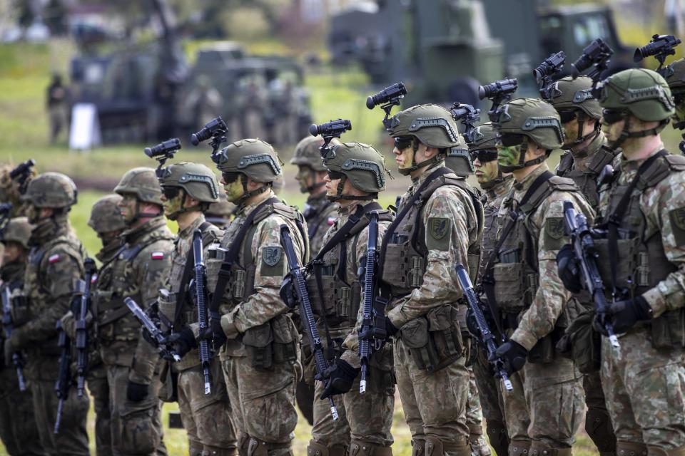 FILE - Lithuanian Army soldiers take part in a Lithuanian-Polish Brave Griffin 24/II military exercise near the Suwalki Gap near the Polish border at the Dirmiskes village, in Lithuania on Friday, April 26, 2024. Poland’s foreign minister says that this NATO nation should not exclude the possibility of sending its troops to Ukraine and should keep Russian leader Vladimir Putin in suspence as to such a decision being ever made. (AP Photo/Mindaugas Kulbis, File)