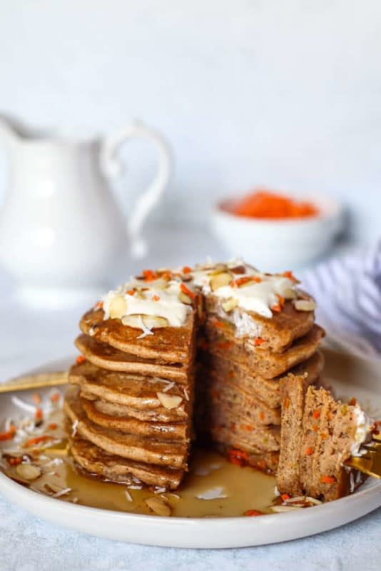 <p>Good Food Baddie</p><p>Who says you can't have dessert for breakfast?! Make delicious, healthy carrot cake pancakes with this easy recipe! Top with coconut yogurt, almonds and maple syrup for the ultimate treat!</p><p><strong>Get the recipe: <a href="https://goodfoodbaddie.com/delicious-gluten-free-carrot-cake-pancakes/" rel="nofollow noopener" target="_blank" data-ylk="slk:Gluten-Free Carrot Cake Pancakes;elm:context_link;itc:0;sec:content-canvas" class="link ">Gluten-Free Carrot Cake Pancakes</a></strong></p>