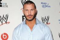 <p>This <a href="https://people.com/sports/randy-orton-who-once-criticized-flag-protest-has-a-change-of-heart-it-took-me-a-little-while/" rel="nofollow noopener" target="_blank" data-ylk="slk:wrestling pro;elm:context_link;itc:0;sec:content-canvas" class="link ">wrestling pro</a> won the heavyweight championship at just 24 years old in 2004, making him the youngest world champion in WWE history.</p>