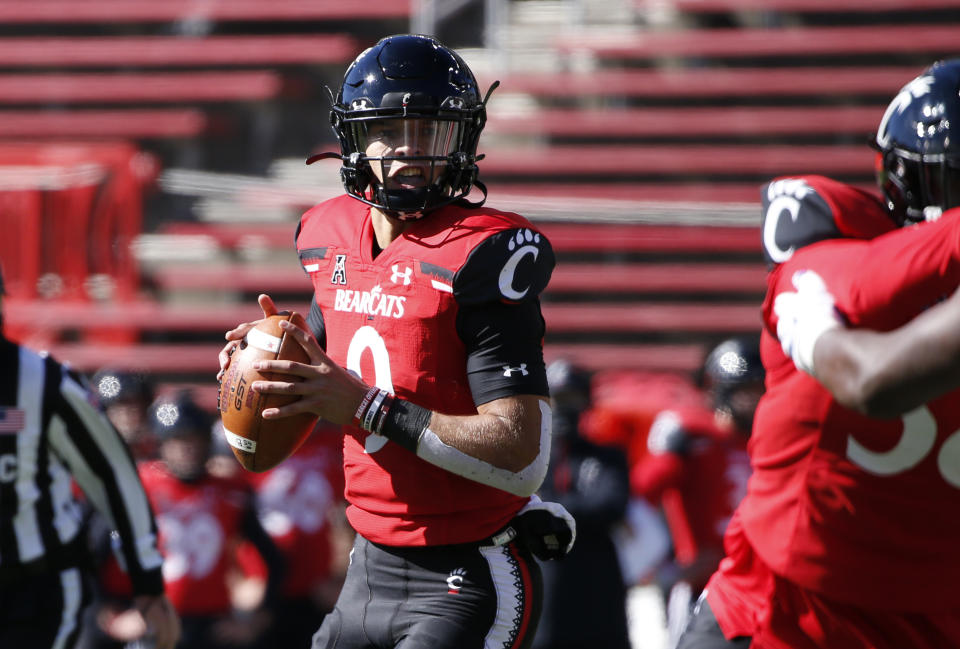 Cincinnati quarterback Desmond Ridder (9) looks to throw against Memphis during the first half of an NCAA college football game Saturday, Oct. 31, 2020, in Cincinnati. (Photo by Gary Landers)