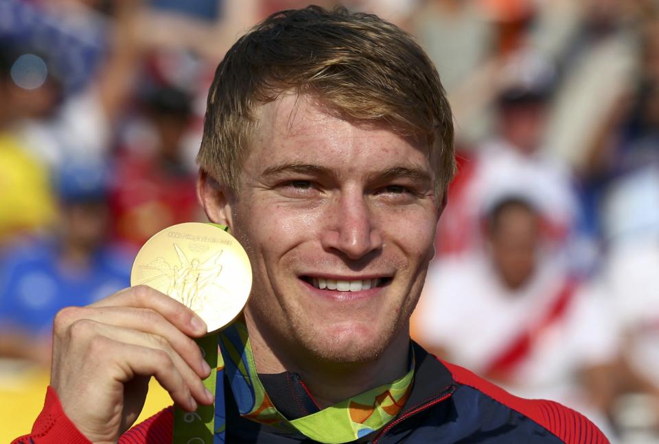 <p>Connor Fields (USA) of USA poses with the gold medal. (Reuters) </p>