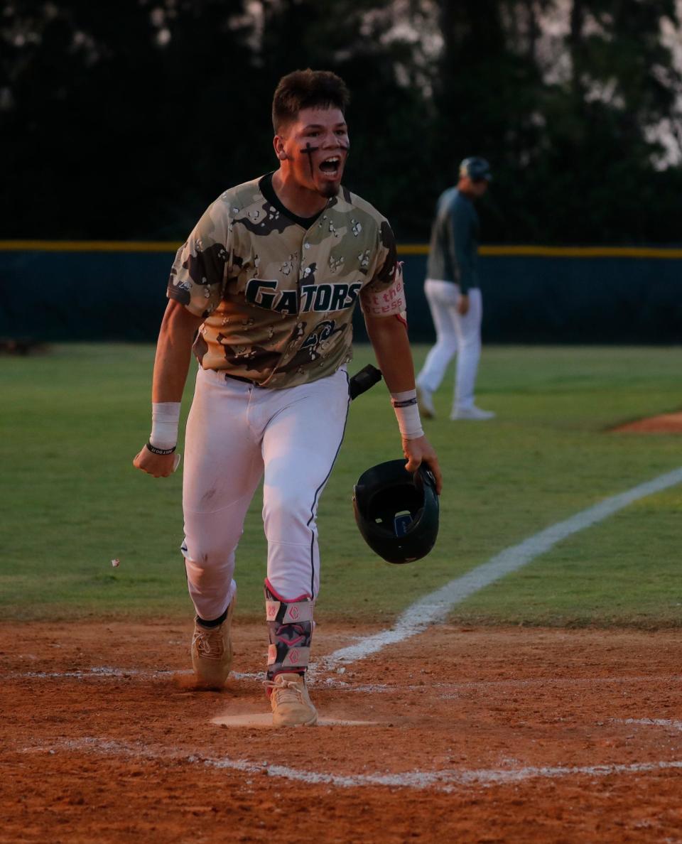 Jake Mueller celebrates after a solo home run. The Island Coast Gators baseball team defeated Miami Springs 4-1 in the  Class 4A-Region 4 Championship game Tuesday, May 17, 2022. The Gators move on to the state semi-finals game. 