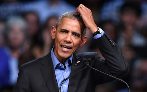 Former US President Barack Obama speaks during a campaign rally for Democratic Gubernatorial Candidate Ralph Northam (unseen) in Richmond - Credit: AFP