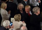 US President Donald Trump greets former secretary of state Hillary Clinton in Statuary Hall in the US Capitol for the Inaugural Luncheon