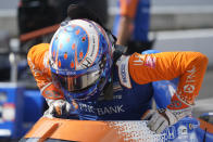 Scott Dixon, of New Zealand, climbs out of his car during qualifications for the Indianapolis 500 auto race at Indianapolis Motor Speedway, Saturday, Aug. 15, 2020, in Indianapolis. (AP Photo/Darron Cummings)