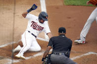 Minnesota Twins' Luis Arraez scores from third base on a wild pitch by Cleveland Indians pitcher J.C. Mejia in the first inning of a baseball game, Thursday, June 24, 2021, in Minneapolis (AP Photo/Jim Mone)