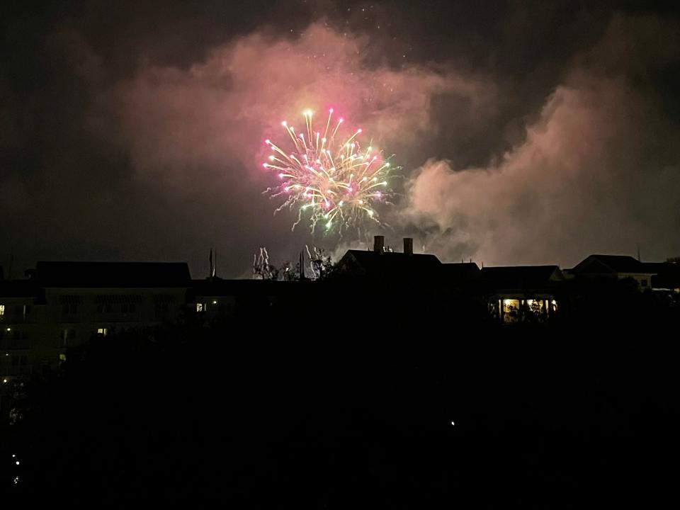 fireworks over the disney world theme parks in the distance viewed from the swan hotel