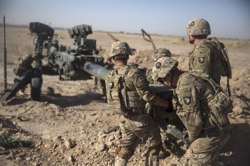 This June 10, 2017 photo provided by Operation Resolute Support, U.S. Soldiers with Task Force Iron maneuver an M-777 howitzer, so it can be towed into position at Bost Airfield, Afghanistan. Sixteen years into its longest war, the United States is sending another 4,000 troops to Afghanistan in an attempt to turn around a conflict characterized by some of the worst violence since the Taliban were ousted in 2001. They are also facing the emergence of an Islamic State group affiliate and an emboldened Taliban, who by Washington's own watchdog's assessment now control nearly half of Afghanistan. (U.S. Marine Corps photo by Sgt. Justin T. Updegraff, Operation Resolute Support via AP)