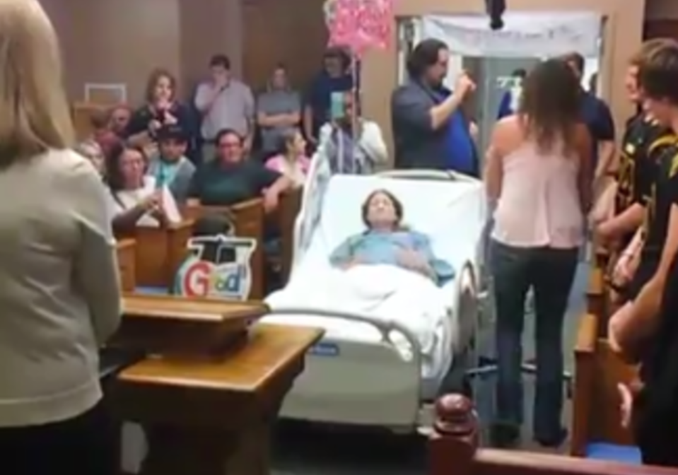 Dalton and his classmates descended on the hospital so his terminally-ill mother could witness his graduation. Source: Storyful