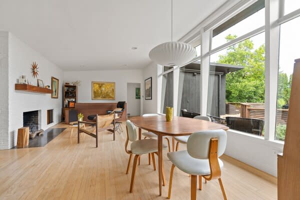 Expansive picture windows span across the main living areas, drawing in ample sunshine.