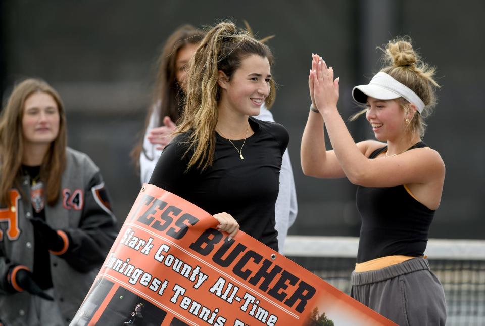 Hoover senior Tess Bucher is honored by her team after defeating Haylee Fearon of Perry in the girls tennis Division I sectional final to become Stark County's all-time winningest player, Saturday, Oct. 7, 2023, at Jackson Park Courts.