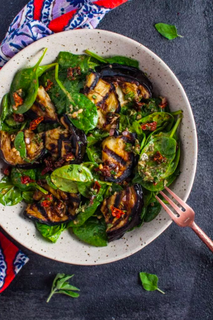 <p>This delicious salad makes a wonderfully fresh, healthy, and filling warm weather meal.</p><p>Get the <a href="https://www.saltandlavender.com/grilled-eggplant-spinach-salad/" rel="nofollow noopener" target="_blank" data-ylk="slk:Grilled Aubergine & Spinach Salad;elm:context_link;itc:0;sec:content-canvas" class="link ">Grilled Aubergine & Spinach Salad</a> recipe.</p><p>Recipe from <a href="https://www.saltandlavender.com/" rel="nofollow noopener" target="_blank" data-ylk="slk:Salt & Lavender;elm:context_link;itc:0;sec:content-canvas" class="link ">Salt & Lavender</a>.</p>