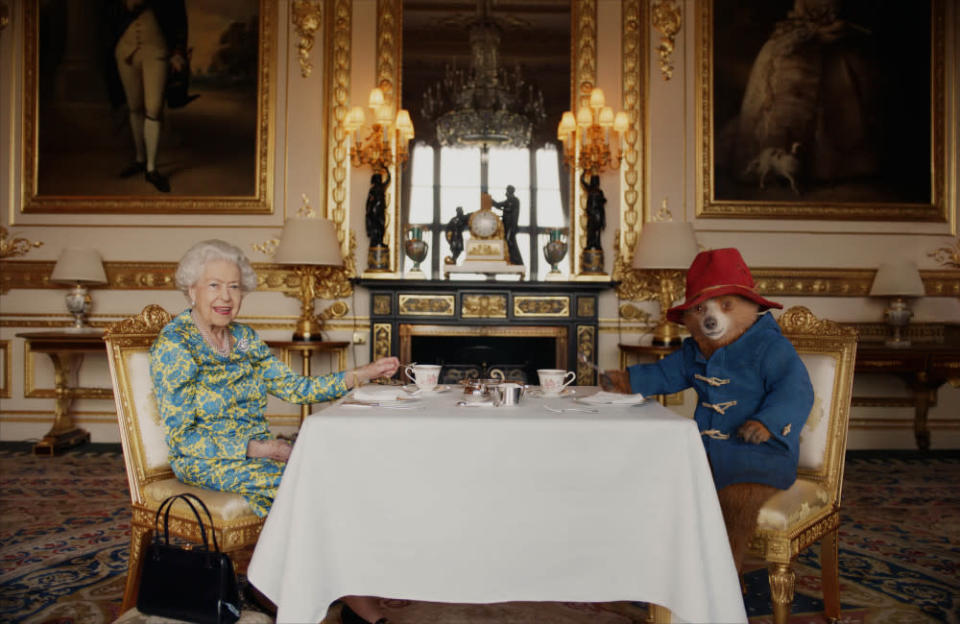 At The Queen's Platinum Jubilee in June, celebrating the monarch's 96th birthday, Elizabeth II filmed a heartwarming sketch with Paddington Bear where she had afternoon tea with the fictional character from the big screen. The bear - voiced by Ben Whishaw - said to HRH: "Happy Jubilee Ma'am. And thank you for everything." To which, she replied: "That's very kind."