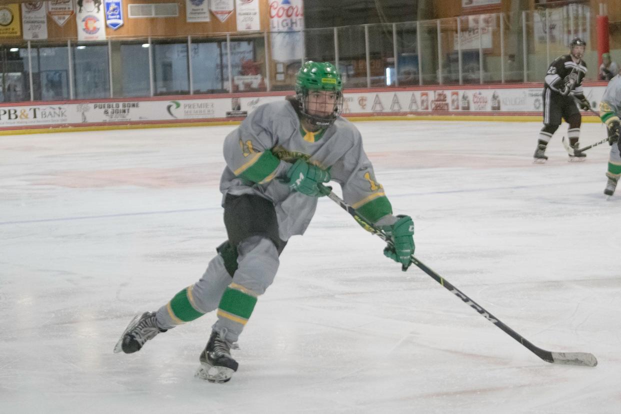 Pueblo County's Zeke Phillips glides across the ice during a matchup with Palmer on Jan. 21.