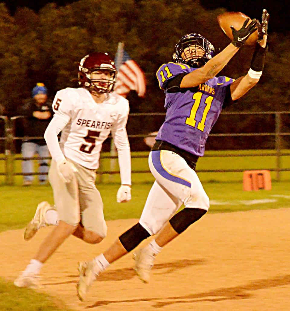 Watertown receiver Ashton First In Trouble (11) has a pass slip through his hands as Spearfish defender Cody Chapman looks on during their Class 11AA high school football game on Friday, Oct. 14, 2022 at Watertown Stadium. The Arrows won 26-7.