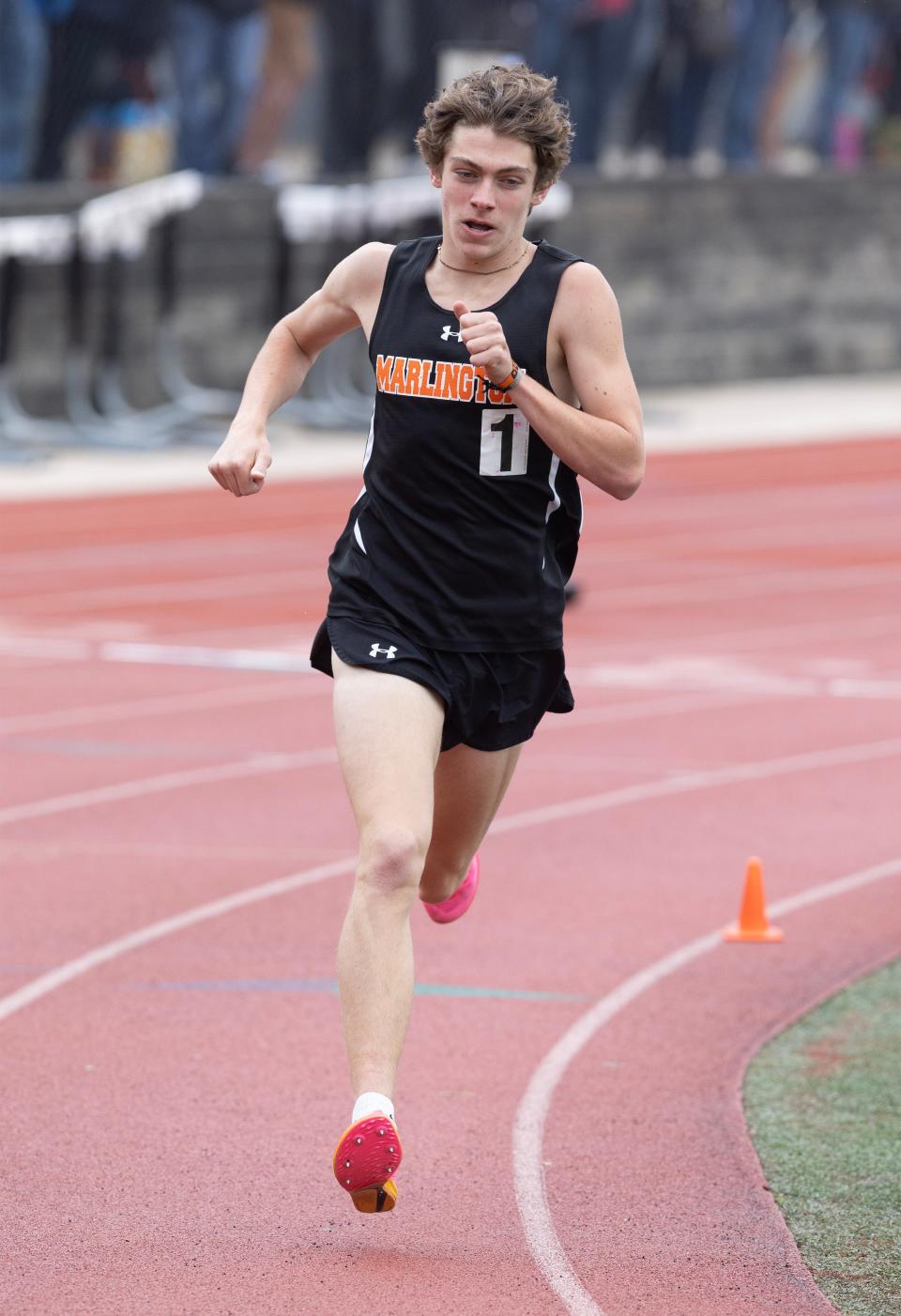 Marlington's Colin Cernansky holds on to a commanding lead on his way to winning the boys 1,600 meters at this year's Division II district track and field meet in Salem.