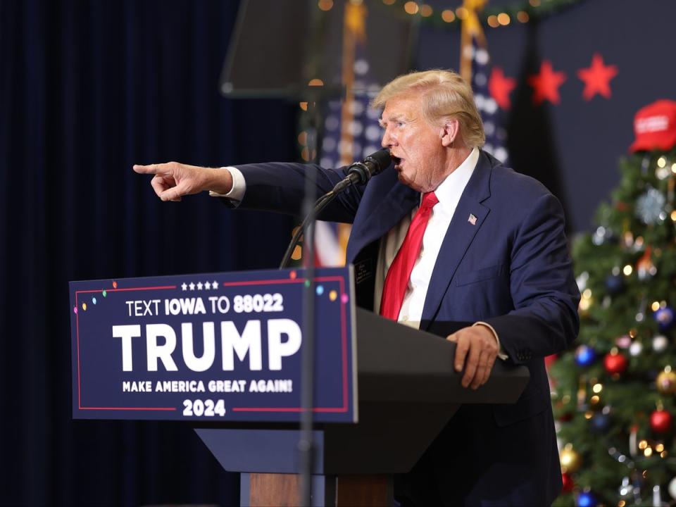 Former US president Donald Trump address a rally crowd in Waterloo, Iowa, on 19 December 2023 (Scott Olson/Getty)