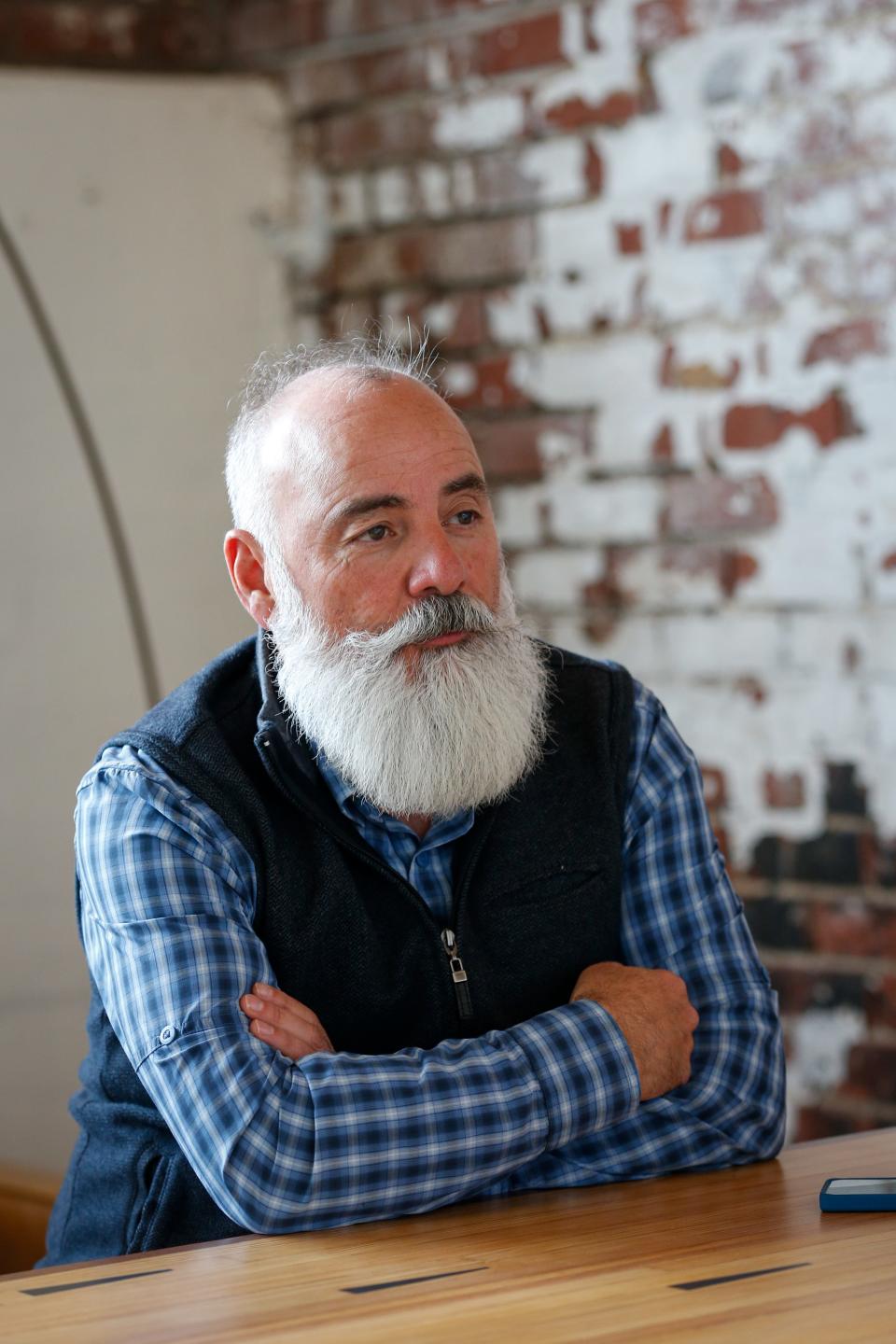 City council candidate Bruce Adib-Yazdi speaks about his campaign at The Vecino Group office on Historic Commercial Street on Tuesday, Feb. 21, 2023. Adib-Yazdi is running for General Seat D.