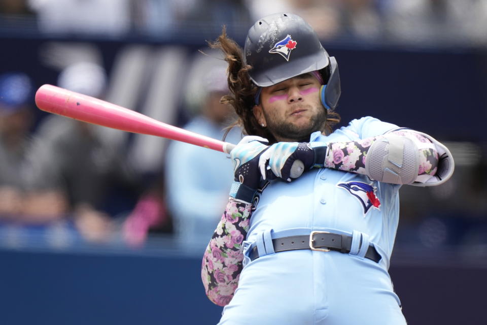 Toronto Blue Jays' Bo Bichette gets out of the way of an inside pitch during the second inning of a baseball game against the Atlanta Braves in Toronto, on Sunday, May 14, 2023. (Frank Gunn/The Canadian Press via AP)