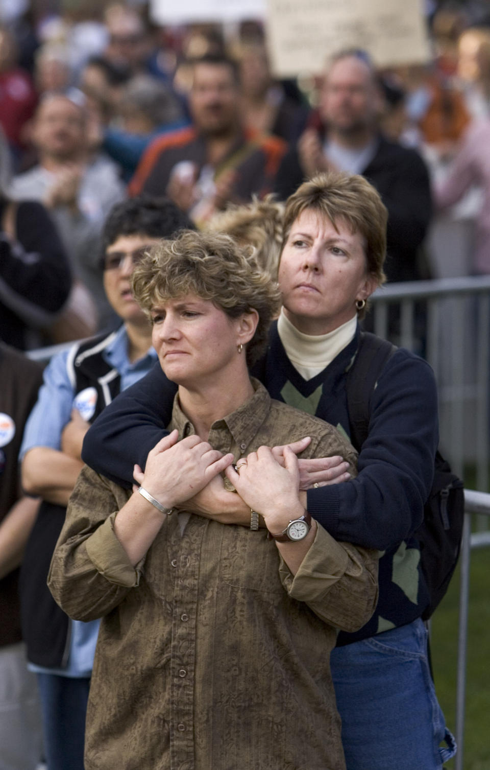 FILE - Nancy Ibbotson, 44, left and Barbara Schumacher, 46, right, both of Sacramento, California, listen to speakers on the west steps of the California state Capitol, Saturday, November 22, 2008, a protest against the recent passage of measure that bans people of the same sex from marrying. California lawmakers are going to try to introduce legislation Tuesday, Feb. 14, 2023, to officially repeal a 15-year-old voter initiative meant to ban same-sex marriage in the state. (AP Photo/Robert Durell,File)