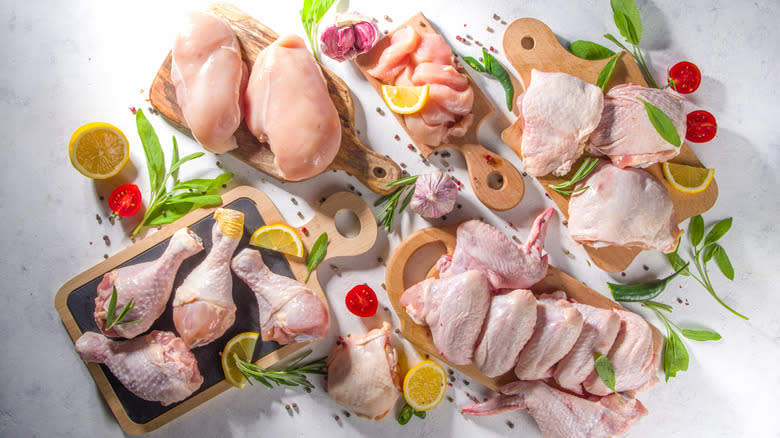 various raw chicken parts and aromatics