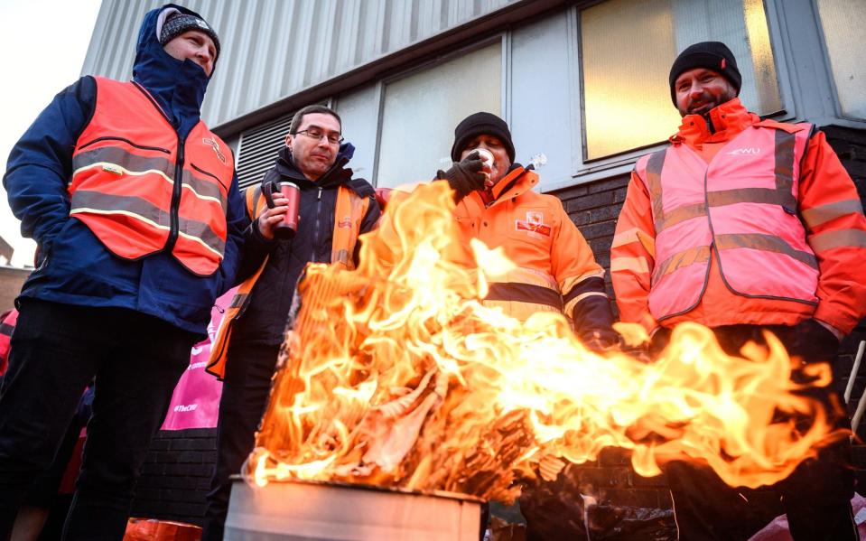 Postal workers on a picket line last Christmas