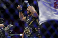 Ciryl Gane celebrates his win over Derrick Lewis after their interim heavyweight mixed martial arts title bout at UFC 265 on Saturday, Aug. 7, 2021, in Houston. (AP Photo/Michael Wyke)