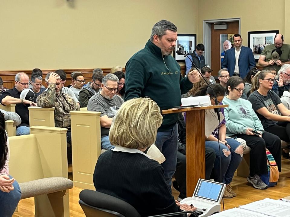 Global Vision Bible Church Associate Pastor Jesse Jones prays as he addresses the Wilson County Planning Commission on March 22, 2024.