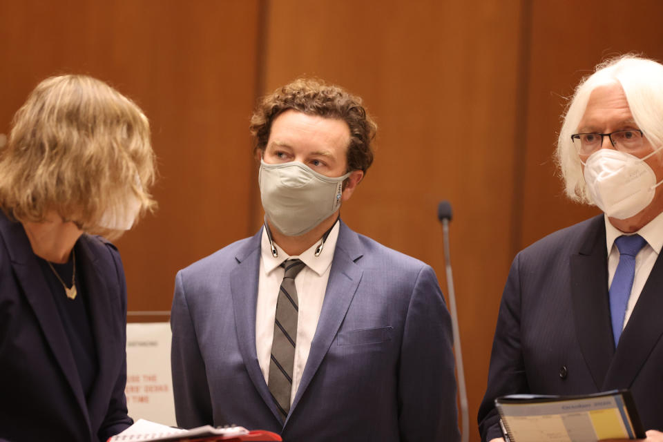 LOS ANGELES, CA - SEPTEMBER 18:  Actor Danny Masterson stands with his lawyers Thomas Mesereau and Sharon Appelbaum as he is arraigned on rape charges at Clara Shortridge Foltz Criminal Justice Center on September 18, 2020 in Los Angeles, California.  Masterson has been charged with forcibly raping three women on separate occasions between 2001 and 2003.  (Photo by Lucy Nicholson - Pool/Getty Images)